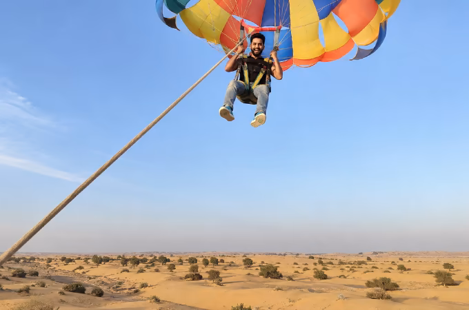 Jeep-pulled parasailing over the desert near Jaisalmer