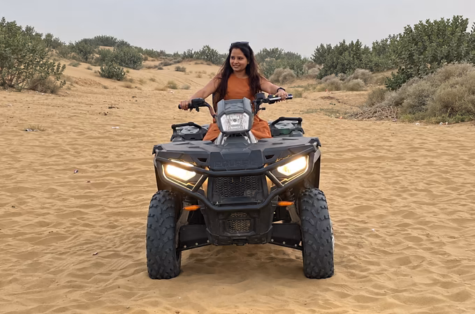 Quad bike riding across sandy desert terrain near Jaisalmer