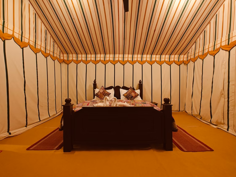 Front view of the king bed inside the Super Deluxe Swiss Tent in Jaisalmer