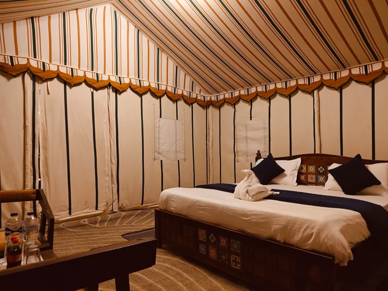 Wide interior view of the Deluxe Swiss Tent near Sam Sand Dunes