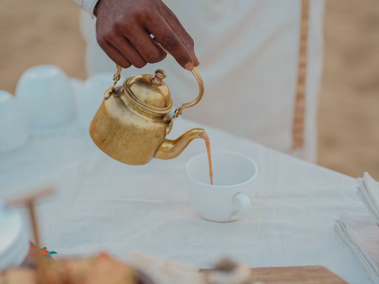 High tea seating near a desert oasis in Jaisalmer