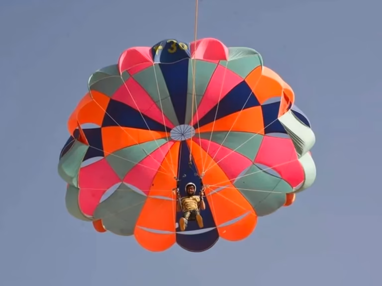 Jeep-pulled parasailing in the desert near Damodra, Jaisalmer