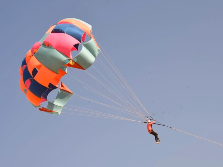 Jeep-pulled parasailing over the desert near Jaisalmer