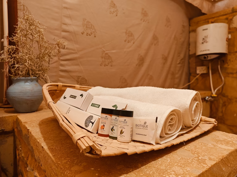 Premium toiletries and fresh towels provided in the Luxury Swiss Tent
