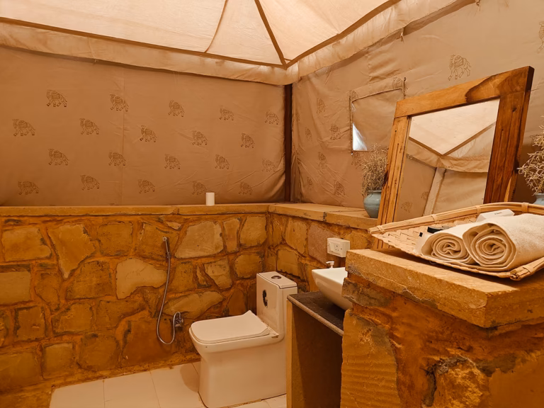 Western toilet and vanity inside the Luxury Swiss Tent bathroom