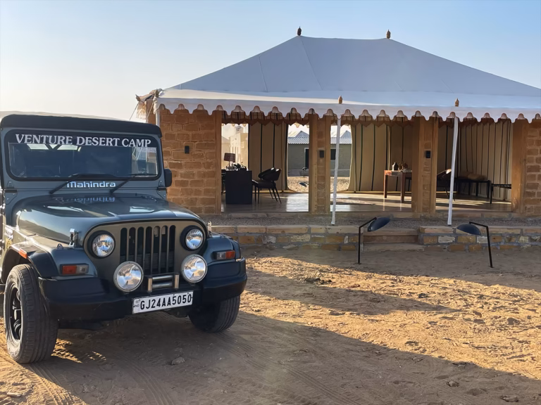 Entrance and parking area at Venture Desert Camp near Sam Sand Dunes