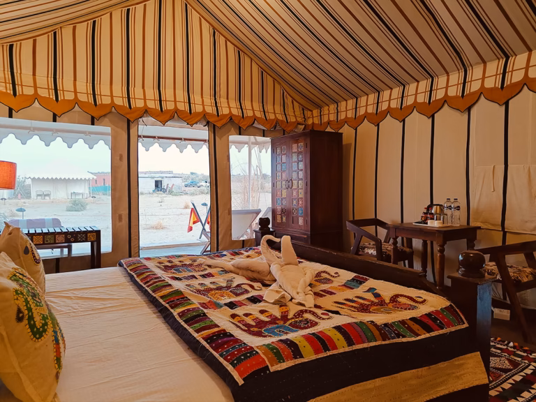 View from the king bed towards the entrance of the Luxury Swiss Tent